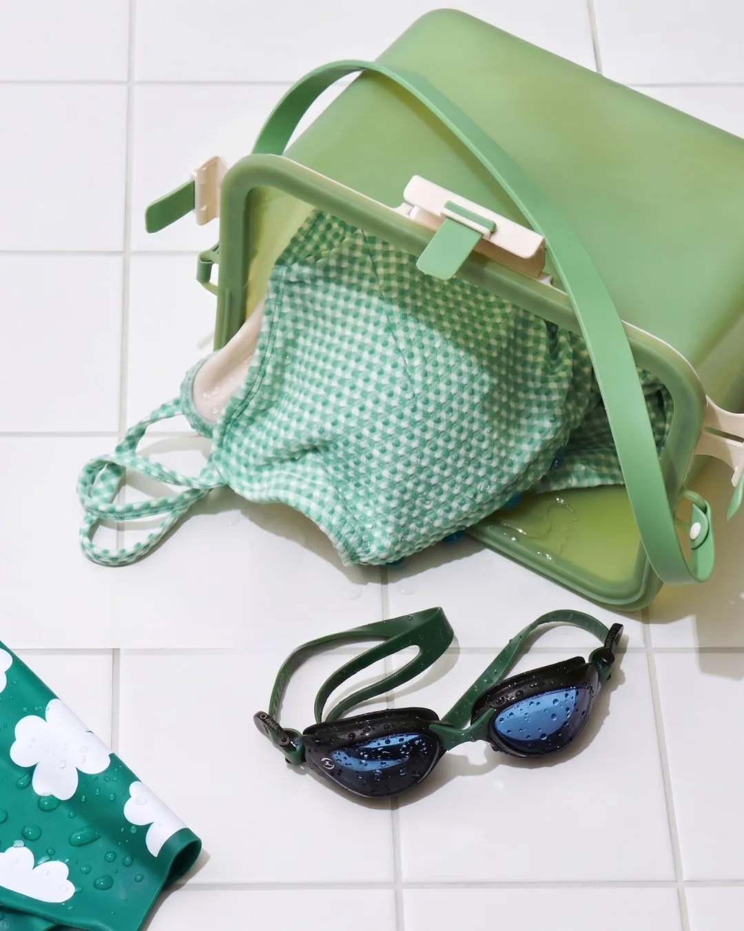 Open green silicone bag showing its frame, strap and interior