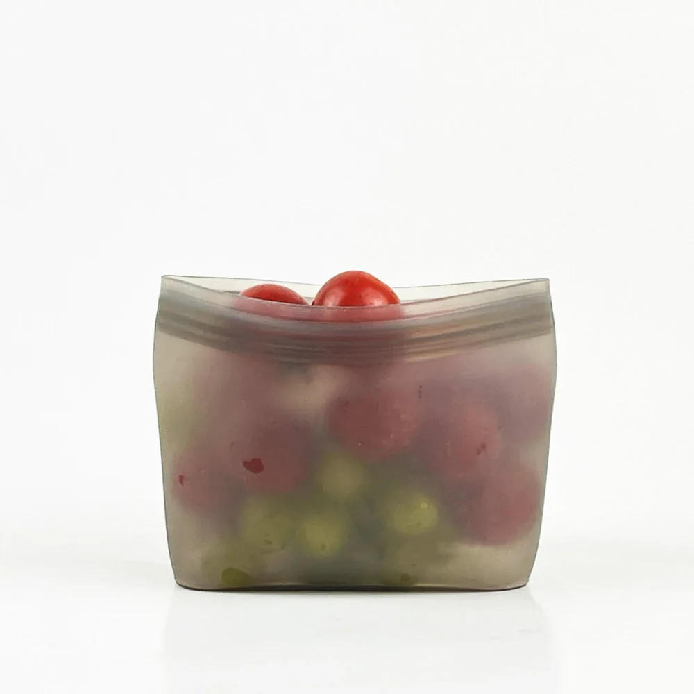 Translucent stand-up silicone food pouch filled with small tomatoes
